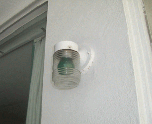 Vintage light fixtures still hang outside each room. Green bulbs give the place a kool 50's aire at night.