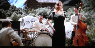 Diana Krall steals a scene with only a few seconds of on-camera time. She should have been given a LOT more.